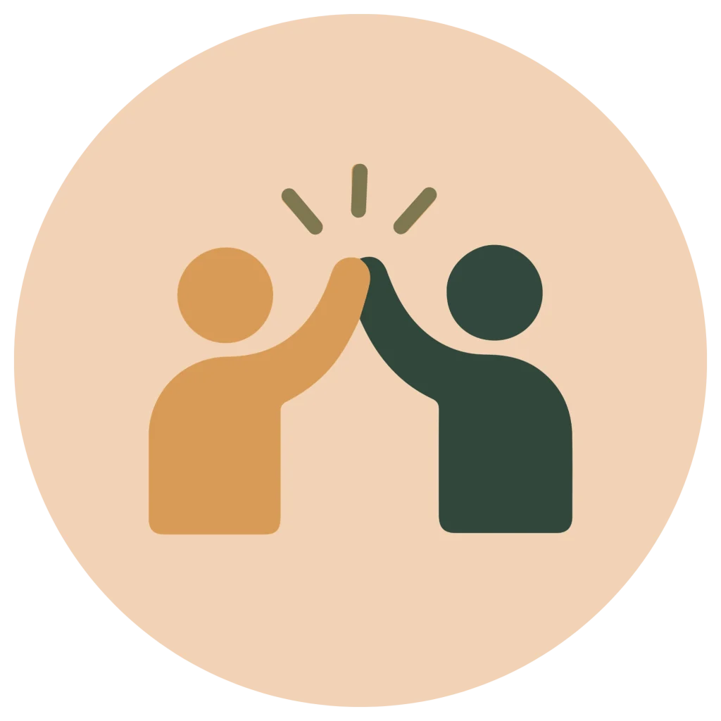 Minimalist flat icon of two user figures giving a high five in orange and dark green, inside a peach circle background.