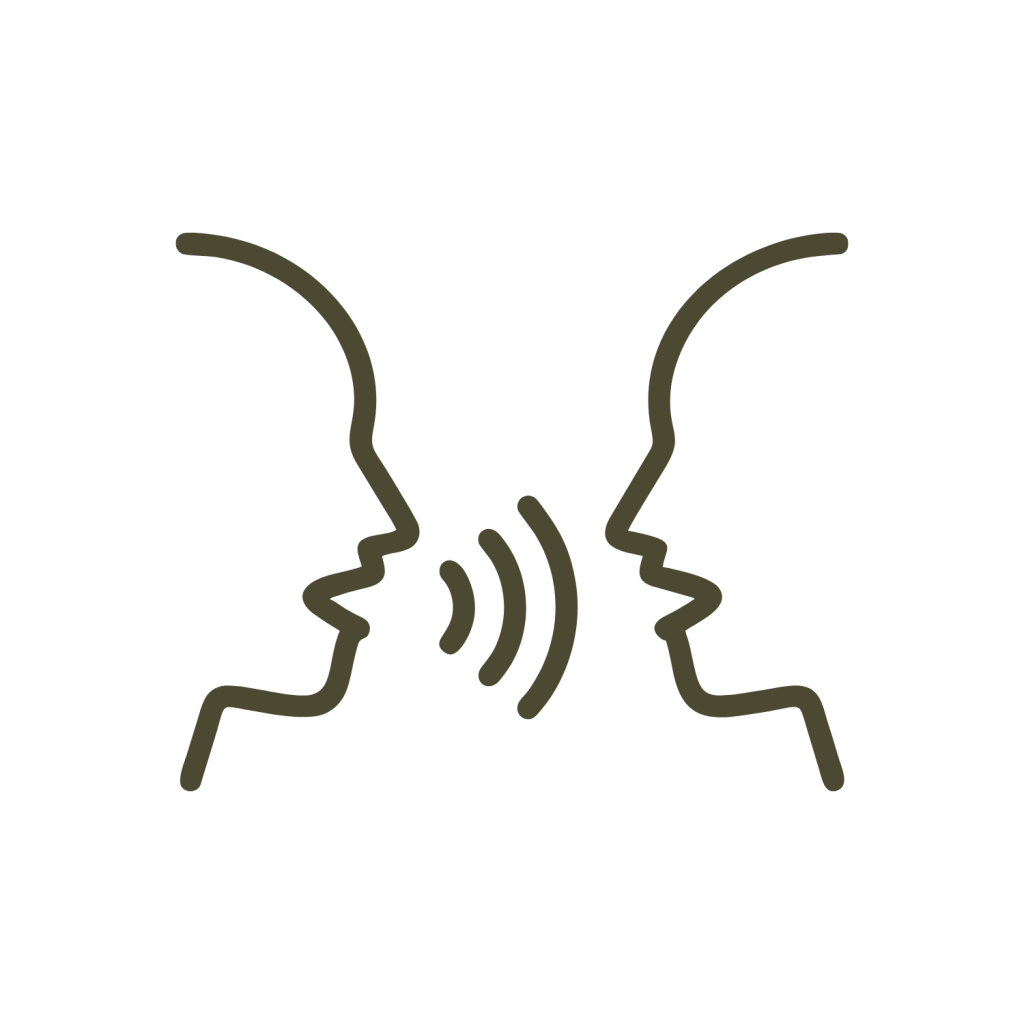 Minimalist line icon of two human head profiles facing each other and talking, in a dark green outline on a white background.