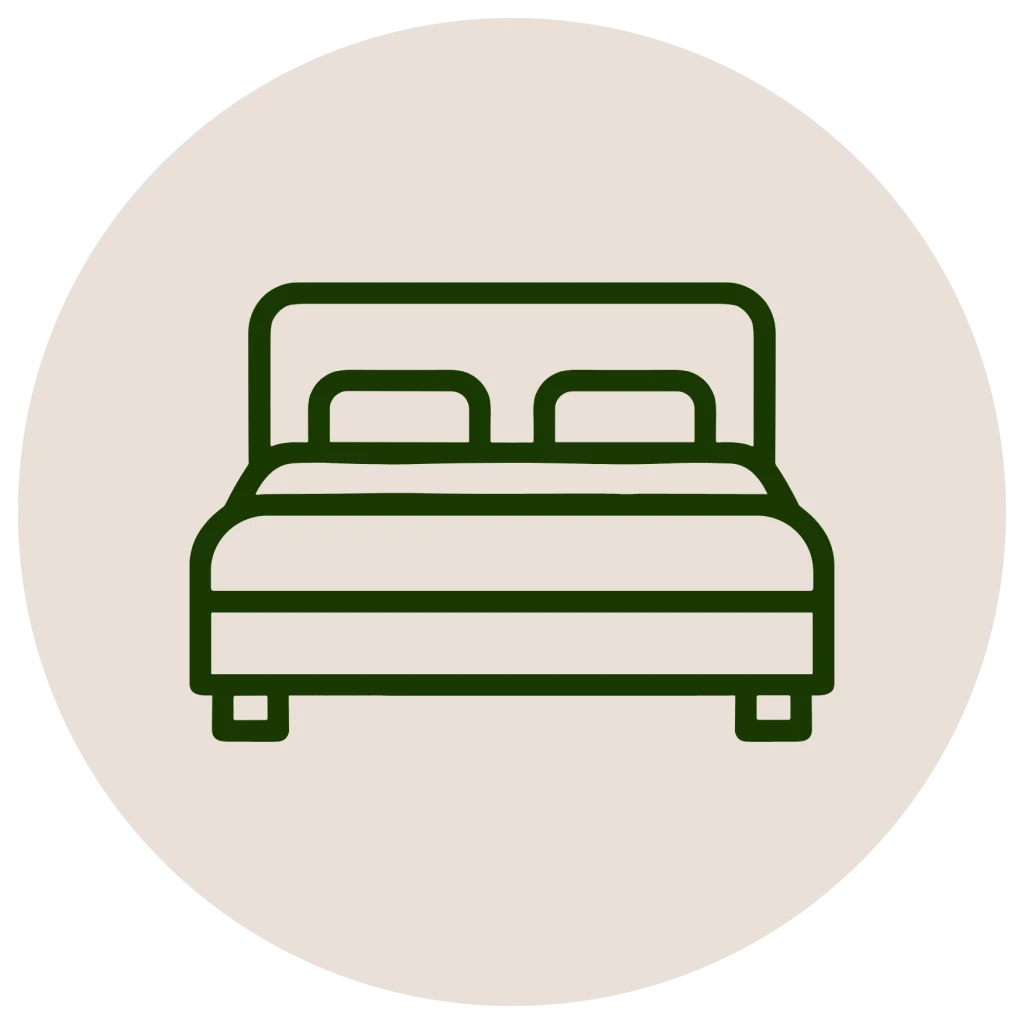 Minimalist line icon of a bed inside a circle, in a dark green outline on an off-white background.