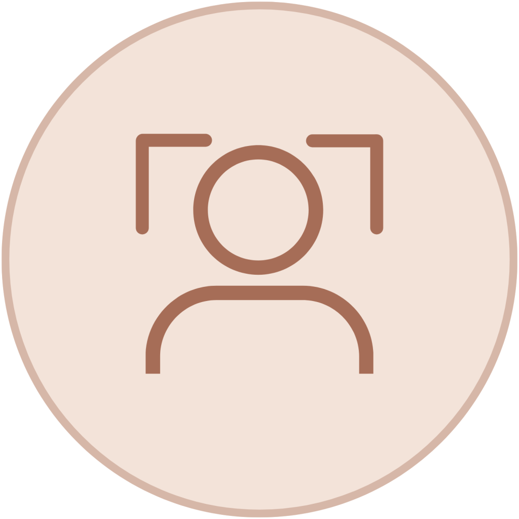 Brown outline icon of a person with facial recognition focus brackets inside a light peach circle.