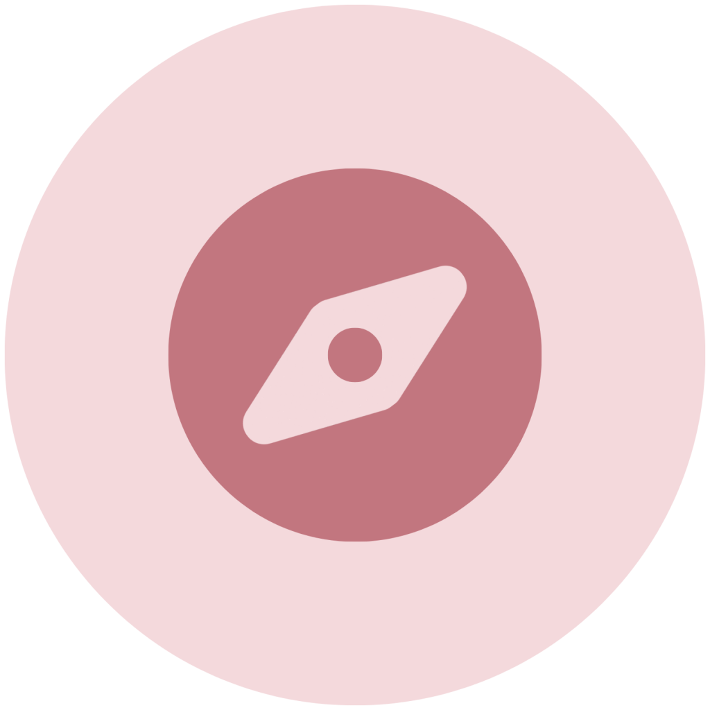 A mauve compass icon centered within a pastel pink circle.
