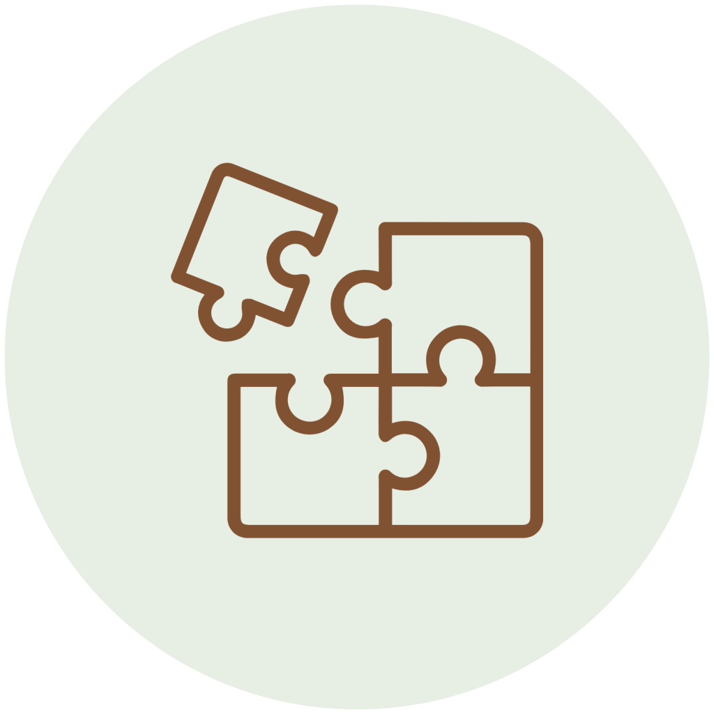 A four piece puzzle icon, centered in a light green circle.